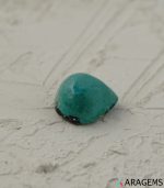 Perspective view of natural Persian turquoise cabochon highlighting teardrop contour, dome depth, and surface polish.