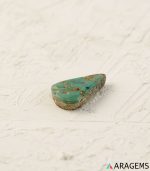Perspective view of teardrop Neyshabur turquoise showing cabochon dome and natural surface details.t15 | Aragems