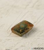 Perspective view of rectangular Iranian turquoise cabochon highlighting surface polish and matrix depth.T18 | Aragems