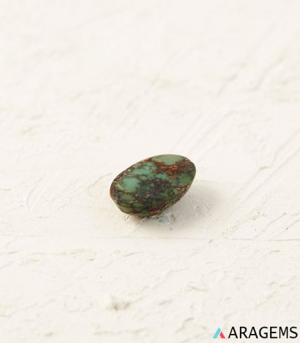 Perspective view of oval Persian turquoise cabochon highlighting dome polish, thickness, and matrix depth.t19