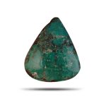 green Iranian turquoise cabochon with natural dark matrix.