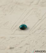 Perspective view of oval Iranian turquoise cabochon showing polished dome and natural pattern.T28-Aragems