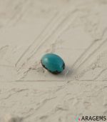 Perspective view of light blue Iranian turquoise cabochon showing polished dome.T29 | Aragems