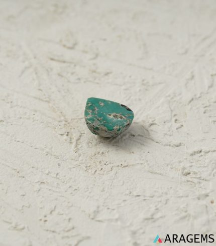 Perspective view of pear-shaped Iranian turquoise cabochon highlighting dome polish and 5 mm thickness.t31
