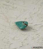 Perspective view of green-blue Persian turquoise teardrop cabochon highlighting smooth dome and natural polish.t32