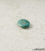 Side view of natural green Kerman turquoise oval cabochon - T40