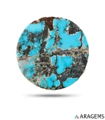 Natural Neyshabur turquoise round cabochon with sky-blue patches in black matrix, front view - T42